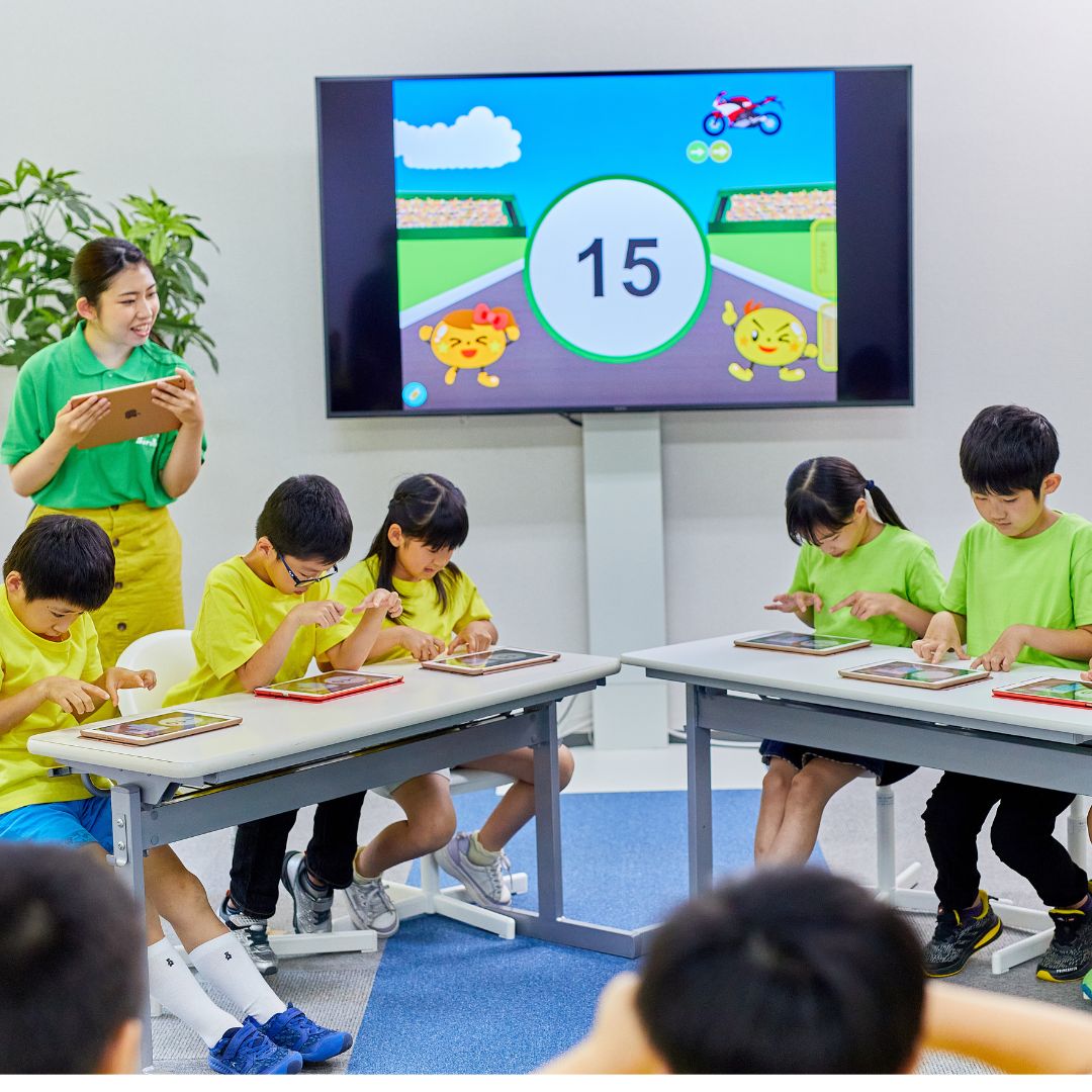 Children learning with tablets in class