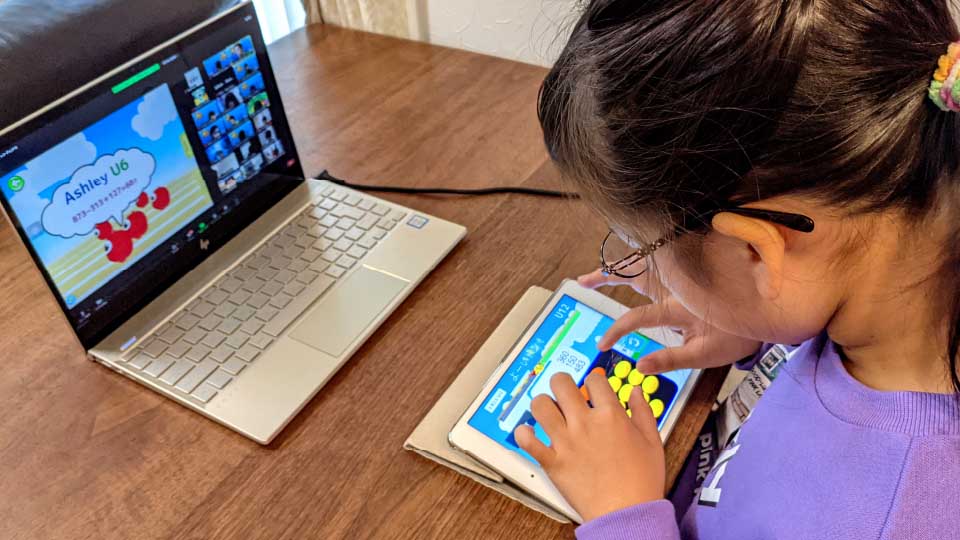 A child learning SoroTouch online